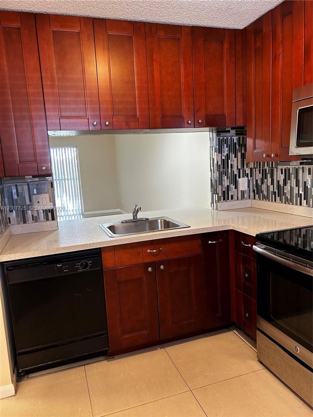 Photo of 713 NW 103rd Ter #203, Pembroke Pines, FL 33026 (MLS # A12007725)