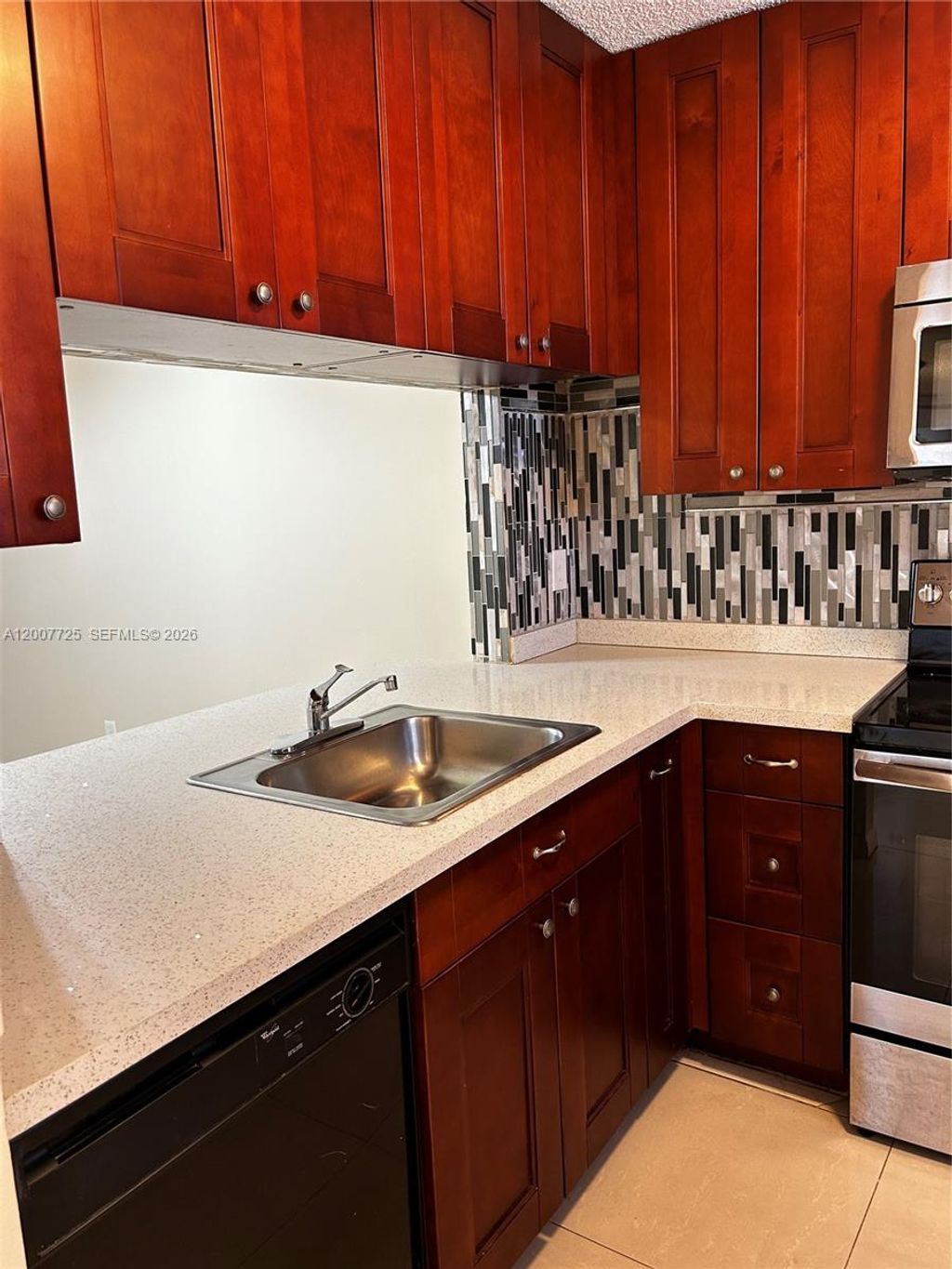 Photo of 713 NW 103rd Ter #203, Pembroke Pines, FL 33026 (MLS # A12007725)