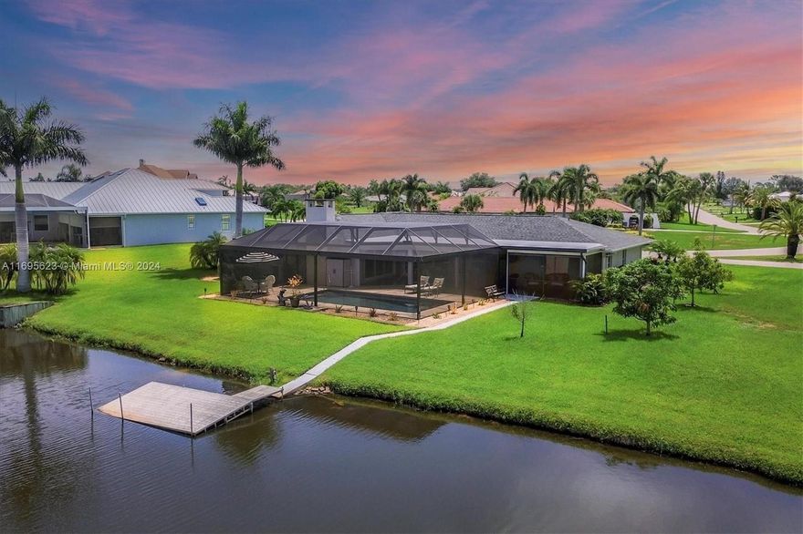 Motivated Seller!! Magnificent western-facing water views from this pristine turn-key home in Lake Suzy on a Double Lot. Available with or without the furniture! The fantastic water view greets you as you walk in through the elegant double doors. The home boasts 3 bedrooms and an office/den, family room featuring a fireplace and open to the kitchen. This home has been well-maintained and EVERYTHING is up to date.
Recent updates include:
• New roof (2023)
• Re-surfaced pool and deck (2021)
• New vinyl flooring (2022)
• Freshly painted exterior (2023)
• New pool cage (2023)
• New septic tank and drain field (2024)
• New windows (2020)
• New well pump (2019)
• Extra insulation (2023)
There are HURRICANE Shutters for every opening in this home.
 This is a one of a kind opportunity!