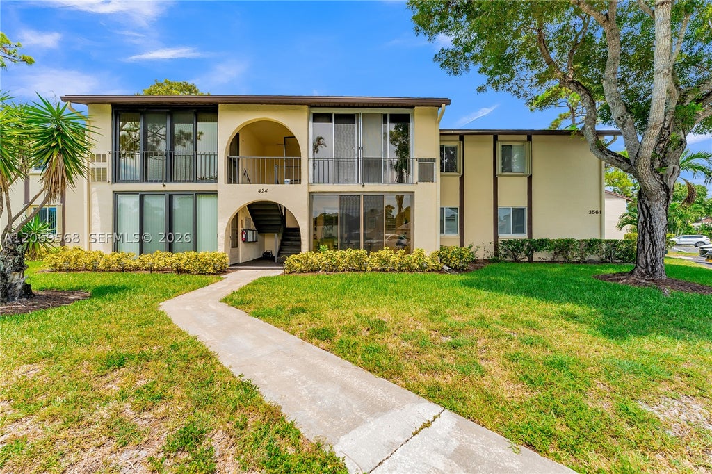 Photo of 3561 Pine Tree Ct #D-1, Green Acres, FL 33463 (MLS # A12069568)