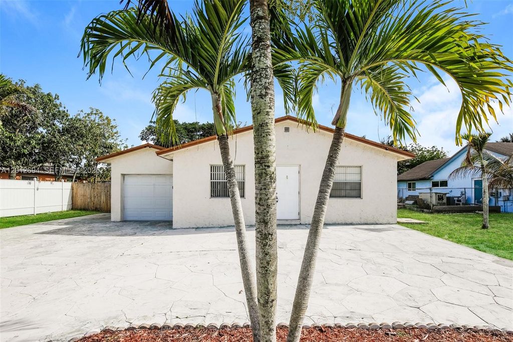 Photo of 7306 SW 3rd Ct, North Lauderdale, FL 33068 (MLS # A12012694)