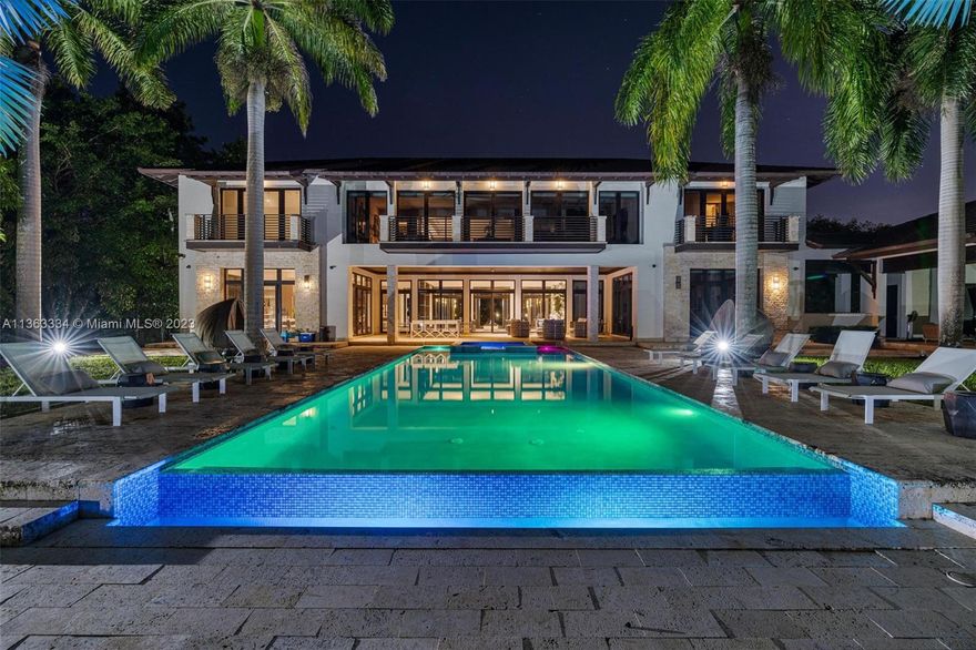 Motivated Seller! Opportunity to own 84,506 SF in the prestigious area of Pinecrest. One of the largest homes ever built on a 2 Acre oasis, rarely available w Contemporary Luxury in the most sought after location. 9Bed 10/2Ba 18,000sf of actual area, with a natural curtain of lush tropical trees surrounding you. Live like you're on your own Island w the most exclusive privacy, resort style ambiance, entertainers paradise and a car connoisseur's dream. Features a front water pool, towering ceilings, 12Ft doors, Theatre, 3 enormous primary suites w unimaginable closet spaces. The most grand kitchen one would ever need, accompanied with a very lavish outdoor kitchen area, teppanyaki grill, bbq and all top of the line appliances. More than enough space to add a tennis/bball court if desired.