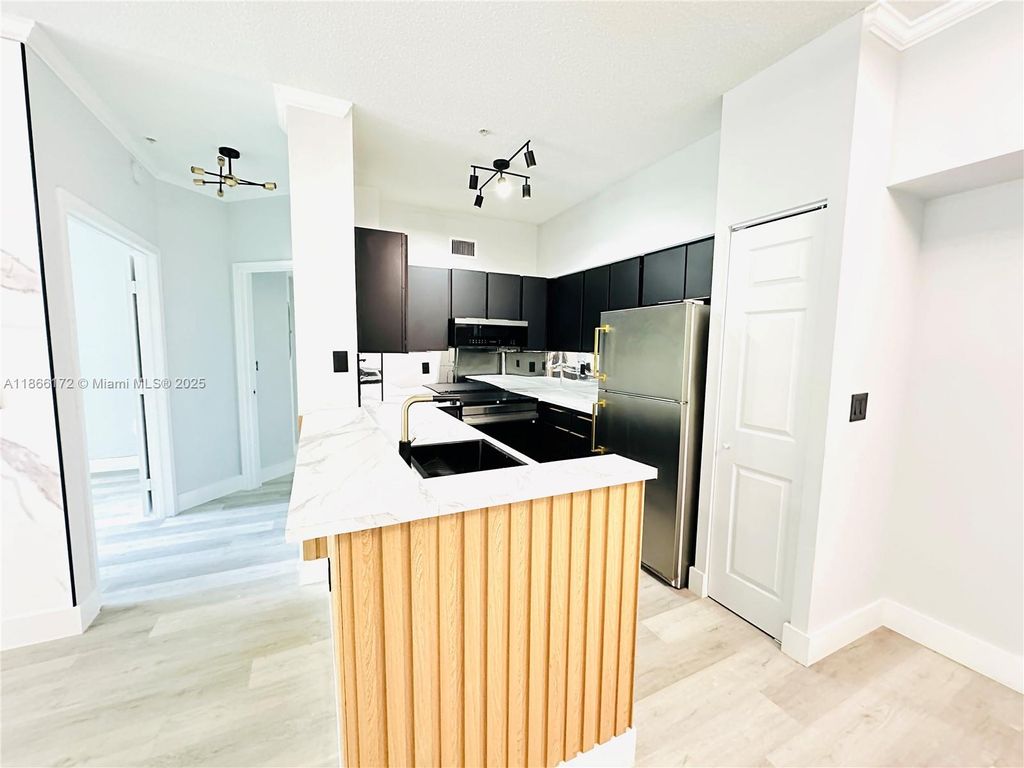 Photo of 11637 W Atlantic Blvd #1233, Coral Springs, FL 33071 (MLS # A11866172)