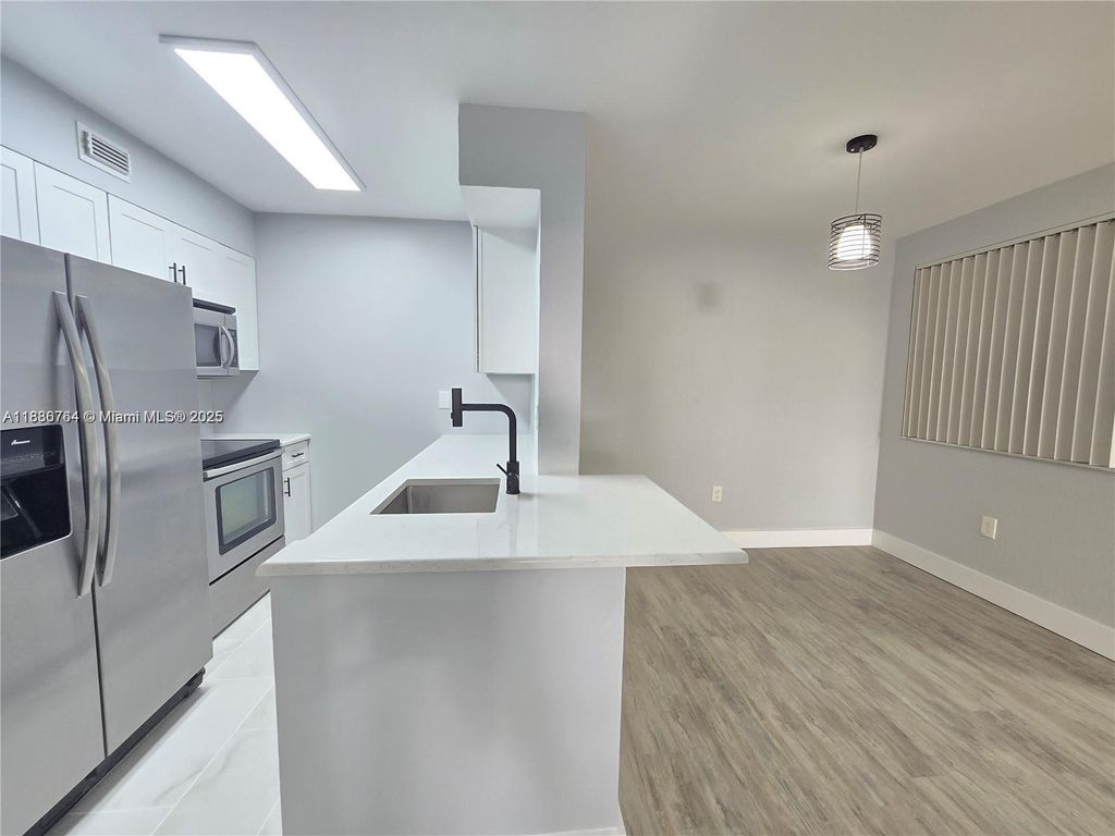 Photo of 2831 N Oakland Forest Dr #108, Oakland Park, FL 33309 (MLS # A11886764)