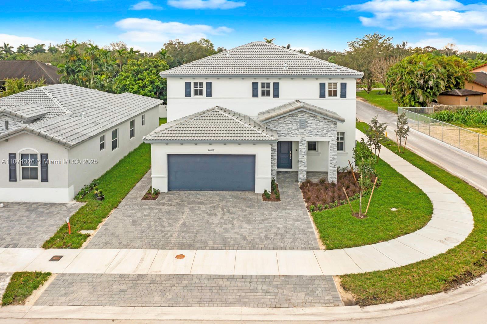 Unique opportunity to own 2 houses in one with completely separate entrances! This is the PIANI Next Generation Model at Salerno. Built in 2023 and located on a corner lot, the primary home features 4 bedrooms, w/ primary bedroom having 2 LARGE closets, and 2.5 bathroom plus a spacious 2 car garage. Common area includes an open layout with a large kitchen island overlooking your family and dining rooms with plenty of space for a breakfast nook or play/reading corner. In your guest suite, or in-law quarters, you have a formal living/dining area, second set of washer/dryer and a good size bedroom. Owner updates include large 24x48 tiles, beautifully accented kitchen backsplash, top grade laminate flooring upstairs, fenced in yard and more! No HOA. A turnkey home waiting for you!