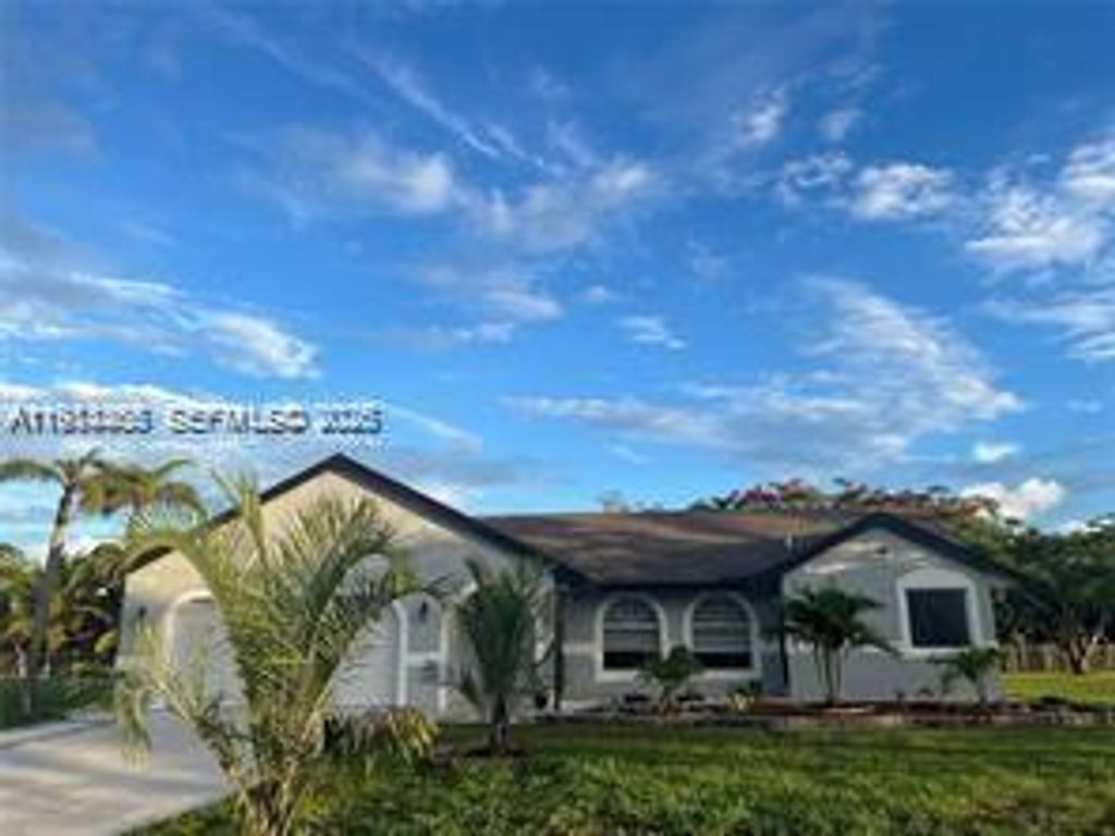 Photo of 15854 Tangelo Blvd, Loxahatchee, FL 33412 (MLS # A11984465)