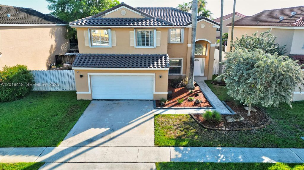 Photo of 19141 NW 12th St, Pembroke Pines, FL 33029 (MLS # A12019418)