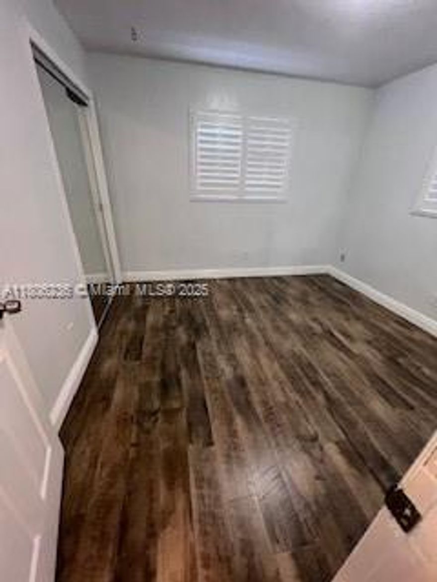 Welcome to your next home!  This well-maintained residence features a fully renovated master bathroom and an equipped kitchen with stainless steel appliances.  The home has been freshly painted and boasts stylish laminated floors, as well as plantation shutters in all three bedrooms. It features impact windows and doors for added security.  Step outside to a patio that features a medium-sized refrigerator and a backyard perfect for outdoor relaxation.  Conveniently located near major highways, shopping, dining, parks, and schools, 5 minutes away from The Guitar Hotel at Seminole Hard Rock.  Washer and dryer included.  No pets allowed.  Available June 1st, 2025.  Offered at $3,150/month. Don't miss this opportunity.