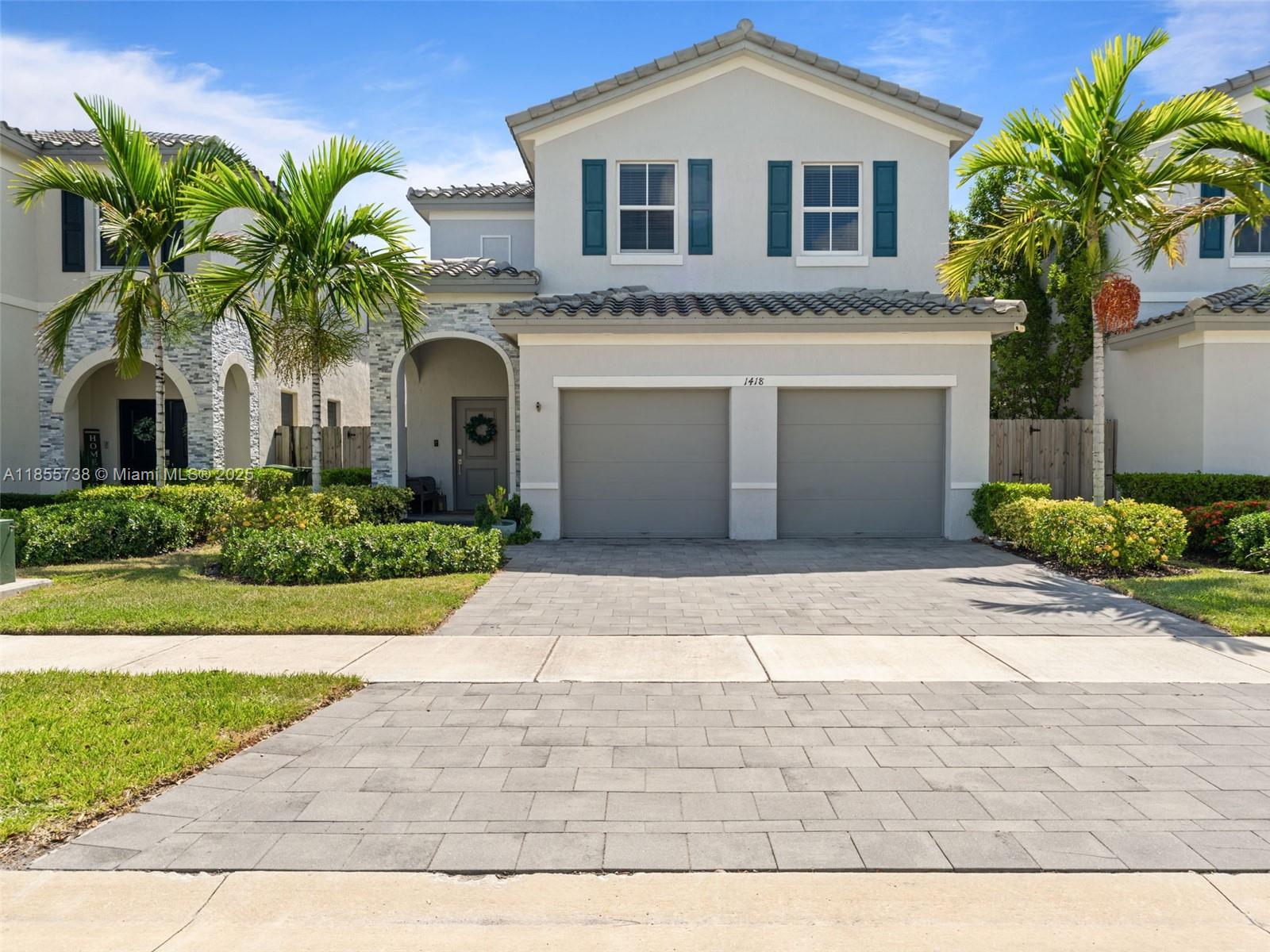 Welcome to this impressive two-story home in Homestead featuring 5 bedrooms & 3 bathrooms, including a convenient 1 bed/1 bath on the first floor, perfect for guests or anyone needing added privacy & easy accessibility. The bright, open layout connects seamlessly to a modern white kitchen featuring stainless steel appliances, a breakfast bar, and abundant counter space. Upstairs, the expansive primary suite includes a luxurious ensuite with double vanities, a soaking tub, and a walk-in shower. Three additional bedrooms provide flexibility for family, guests, or a home office. The private fenced backyard boasts low-maintenance turf and a spacious patio, ideal for outdoor gatherings. Complete with a two-car garage prime location close to Turnpike, The Florida Keys, shops, dining & Hospitals.