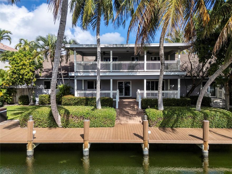 Own a secluded waterfront paradise in Hollywood! This immaculate home is just minutes from Hollywood Beach, top dining, shopping, and entertainment. A boater’s dream, it boasts a 60’ deep-water dock with a wide turnaround for convenience. Spanning over 3,500 sqft, the home offers two covered porches with tranquil water views. Relax in the 6-person hot tub while watching breathtaking sunsets. The spacious galley kitchen is an entertainer’s delight, featuring 2 dishwashers, 2 fridges, a wine cooler, and double ovens (kosher kitchen setup possible). Ideal for multigenerational living, a private back room entrance is perfect for an in-law suite. This prime location offers easy access to major highways, airports, and all that South Florida has to offer.