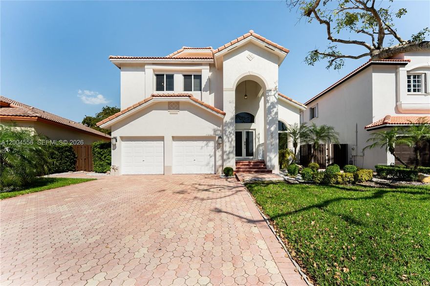 Welcome to Doral Isles Antilles! This spacious 4-bedroom, 3-bathroom two-story single-family home sits on an oversized 7,448 SF lot in one of Doral’s most desirable guard-gated communities with 24-hour security. Hurricane impact windows and doors provide added protection and efficiency. Enjoy a custom covered patio with summer kitchen, built-in grill, and mini refrigerator, perfect for entertaining. Just steps from the clubhouse with resort-style amenities including pools, jacuzzi, sauna, gym, restaurant, and tennis, basketball, and soccer courts. Conveniently located near the Florida Turnpike, schools, International Mall, Dolphin Mall, and dining. The updated kitchen features dark wood cabinetry, quartz countertops, mosaic backsplash, LG French door refrigerator, wine cooler, oven, built-in microwave, and island range hood. Vaulted ceilings and abundant natural light enhance the home throughout. All bedrooms are upstairs, including a spacious primary suite with tray ceilings, walk-in closet with built-ins, soaking tub, separate shower, dual vanity, and bidet. Washer and dryer included. Vacant and easy to show.