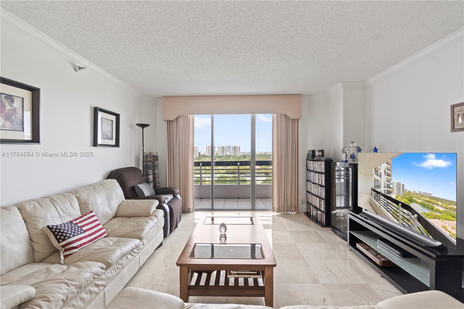 This stunning split floorplan condo offers 2 spacious primary bedrooms with ensuite bathrooms and breathtaking marina and tropical island views. Abundant natural light pours in through the floor-to-ceiling windows. The semi-open kitchen seamlessly integrates with the dining and living areas, creating a perfect space for entertaining. Beautiful pristine marble floors add to the appeal. The oversized bathrooms offer large vanities and showers. Washer and dryer. Hurricane shutters. Mystic Pointe, the crown jewel of Aventura, offers resort-style amenities like pickleball, tennis, restaurant overlooking the marina, lush grounds, 24/7 security, dog park, valet, basketball, play-ground, and more. Minutes from Aventura Mall houses of worship, and top-rated schools. A perfect place to call home!