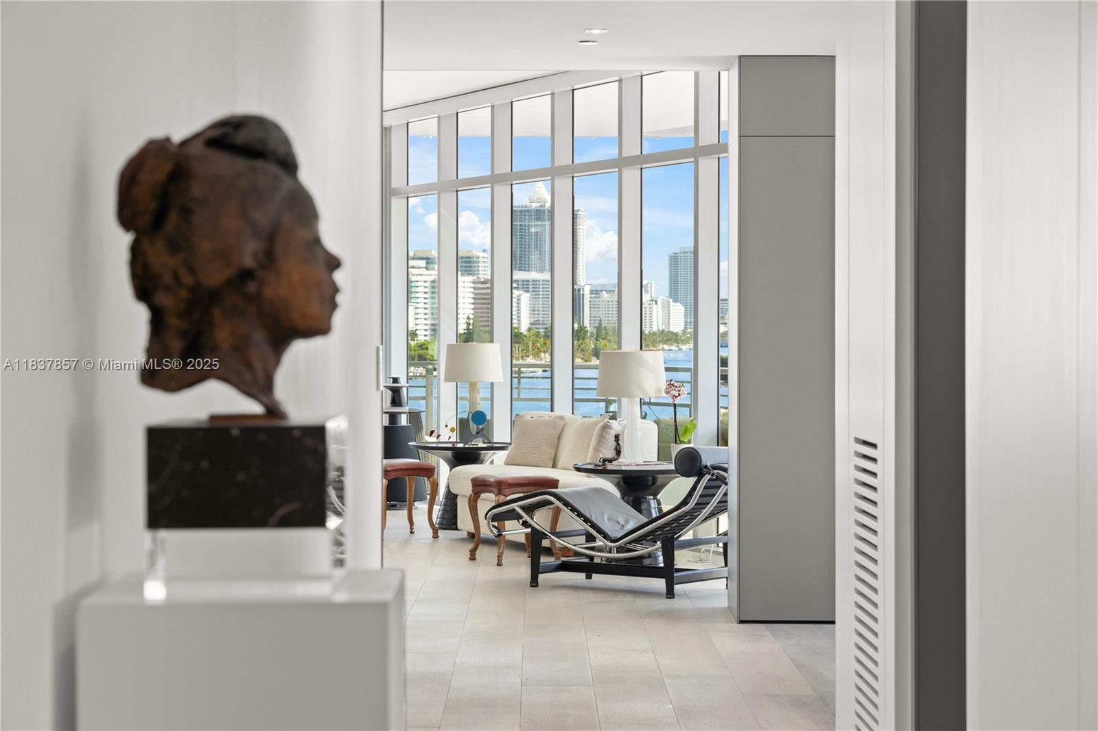 Welcome to life on private Aqua Island. Experience breathtaking views from this completely-gut renovated & tastefully curated waterfront residence. Best line in the building! Reimagined over 3 years with ultra-luxury finishes, thoughtful design, raised ceilings, & all new everything! Offering direct southern & western exposures from a wraparound balcony, with sleek metal louvers framing unparalleled Intracoastal, downtown, & sunset views. Every bedroom features its own en-suite bath, offering privacy & comfort. 2 assigned parking + free valet. Finishes include Italian ceramic wide oak floors, a Bulthaup German kitchen, solid oak cabinetry, Italian marble bath elements, La Grande Smart Home System, & electric blinds in every room. OPTION TO COMBINE WITH ADJOINING UNIT (603).