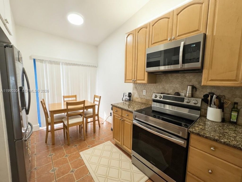 Photo of 1061 NW NW 53rd St, Deerfield Beach, FL 33064 (MLS # A11990304)