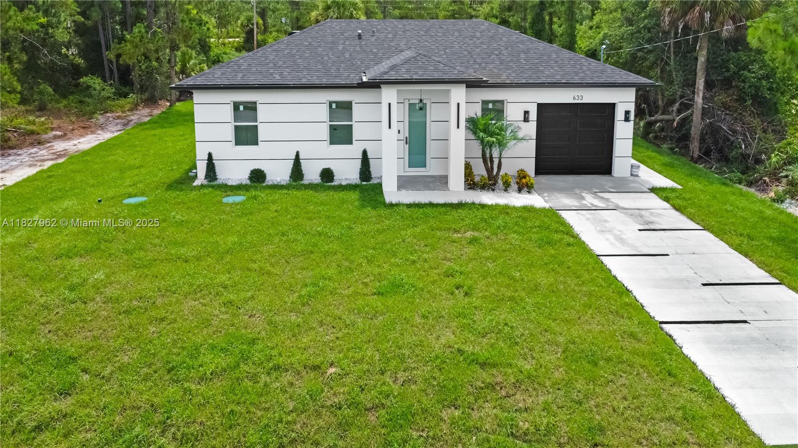 Beautifully upgraded 3 bed, 3 bath home with high-end finishes and great income potential! A section of the home already features a private entrance and full bath—perfect for converting into an efficiency or guest suite. Impact windows, stainless steel appliances, tankless water heater, quartz countertops, and modern bathrooms with glass shower doors and LED mirrors. Enjoy the peaceful setting with mature pine trees, beautiful landscaping, and a custom-built wall with chimenea. One-car garage. A perfect blend of comfort, style, and opportunity! A TV has Been installed that can remain with the property at no additional cost. TV is not new and is offered as-is with no warranty.