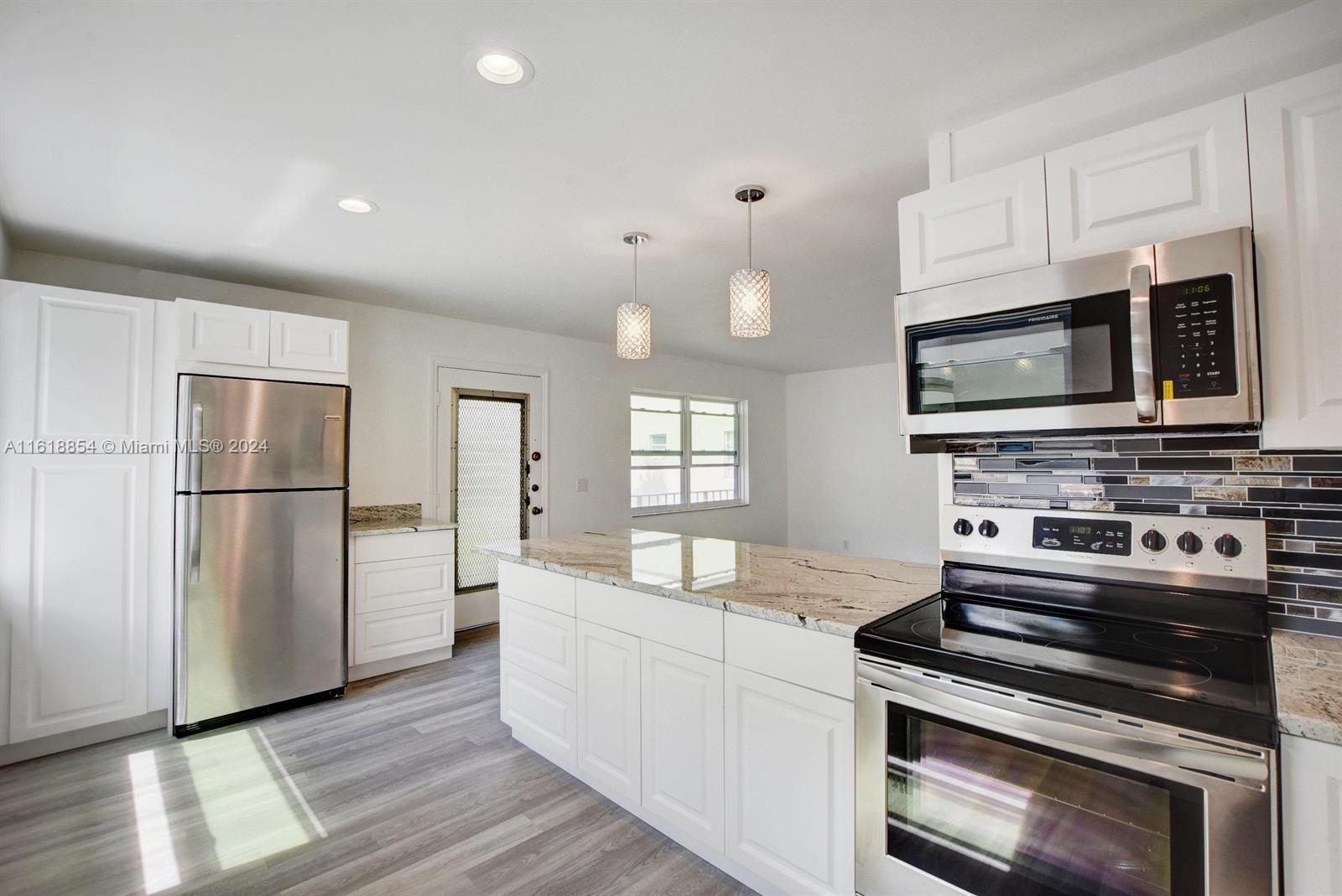 Renovated 2 Bedroom, 2 Bathroom Condo with Stunning Golf and Water Views in Kings Point Golf and Country Club, a 55+ Community! Welcome to your ideal seasonal getaway or retirement haven! This meticulously updated condo boasts a complete renovation from top to bottom. Features include a gorgeous kitchen with pantry, brand new appliances, and a private laundry room. The home is equipped with accordion hurricane shutters and offers an enclosed patio. Pet-friendly and with countless amenities such golf, tennis courts, pickleball, 2 clubhouses, 6 pools (including 2 indoors), a gym, library, and a 1200-seat theater, there's something for everyone.
