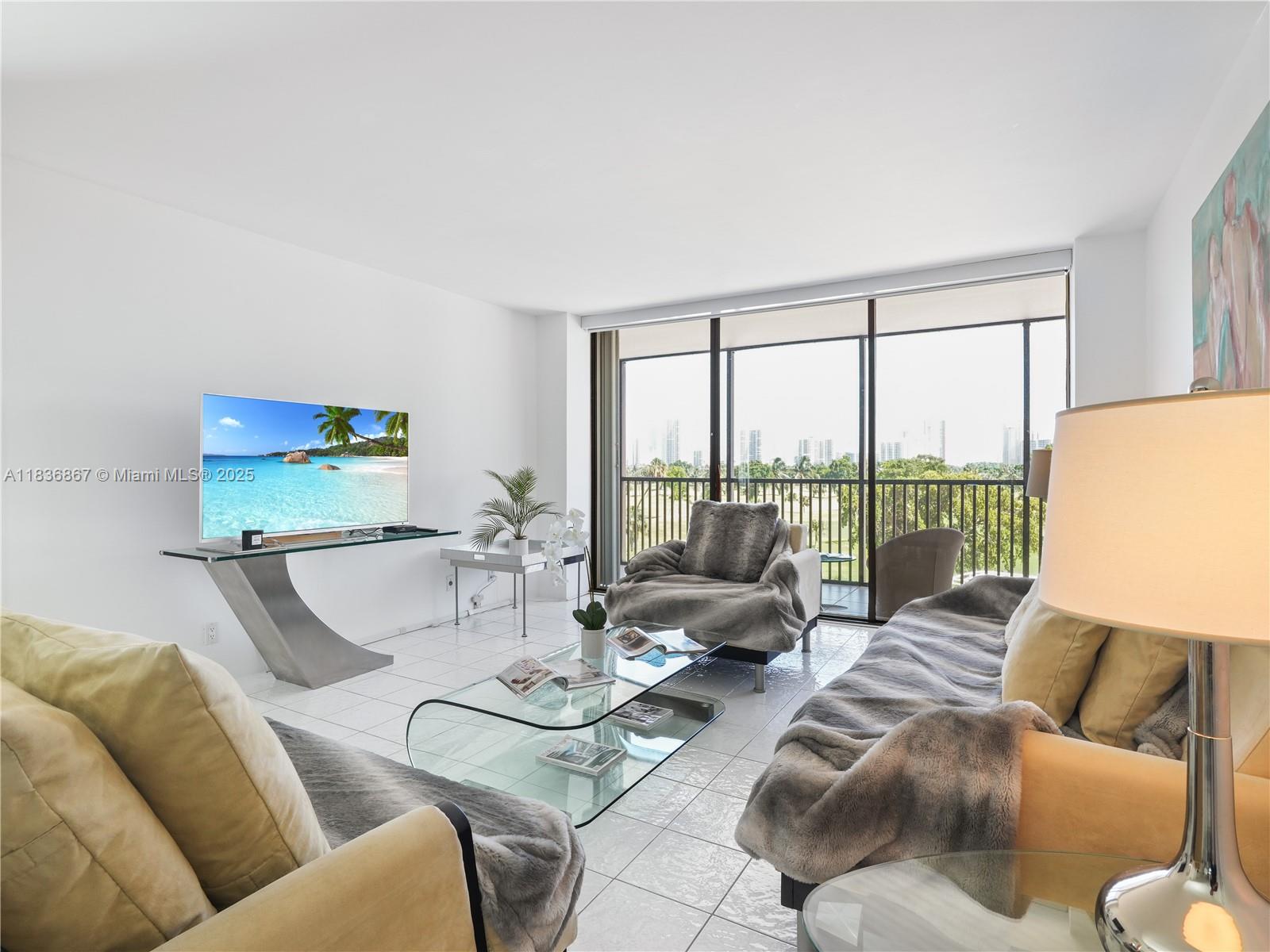The most desirable and largest 06 line in the building, this 2 bed 2 bath condo features access to the balcony from all bedrooms and the living room. Tile floors and a split-style floor plan allow natural light throughout the unit, Walk In Closet. Spacious balcony with beautiful golf course views and hurricane shutters. Includes 1 assigned parking space in a covered garage and 1 storage unit. Just minutes to the beach, Aventura Shopping Mall, Turnberry Golf Course, Sunny Isles, US1, supermarkets, cafes and restaurants. Secured gated community with plenty of guest parking spaces. The building passed 40-year certification and features renovated halls, lobby and elevators. Amenities include fitness center, pool, sauna, jacuzzi, and 24-hour security.
