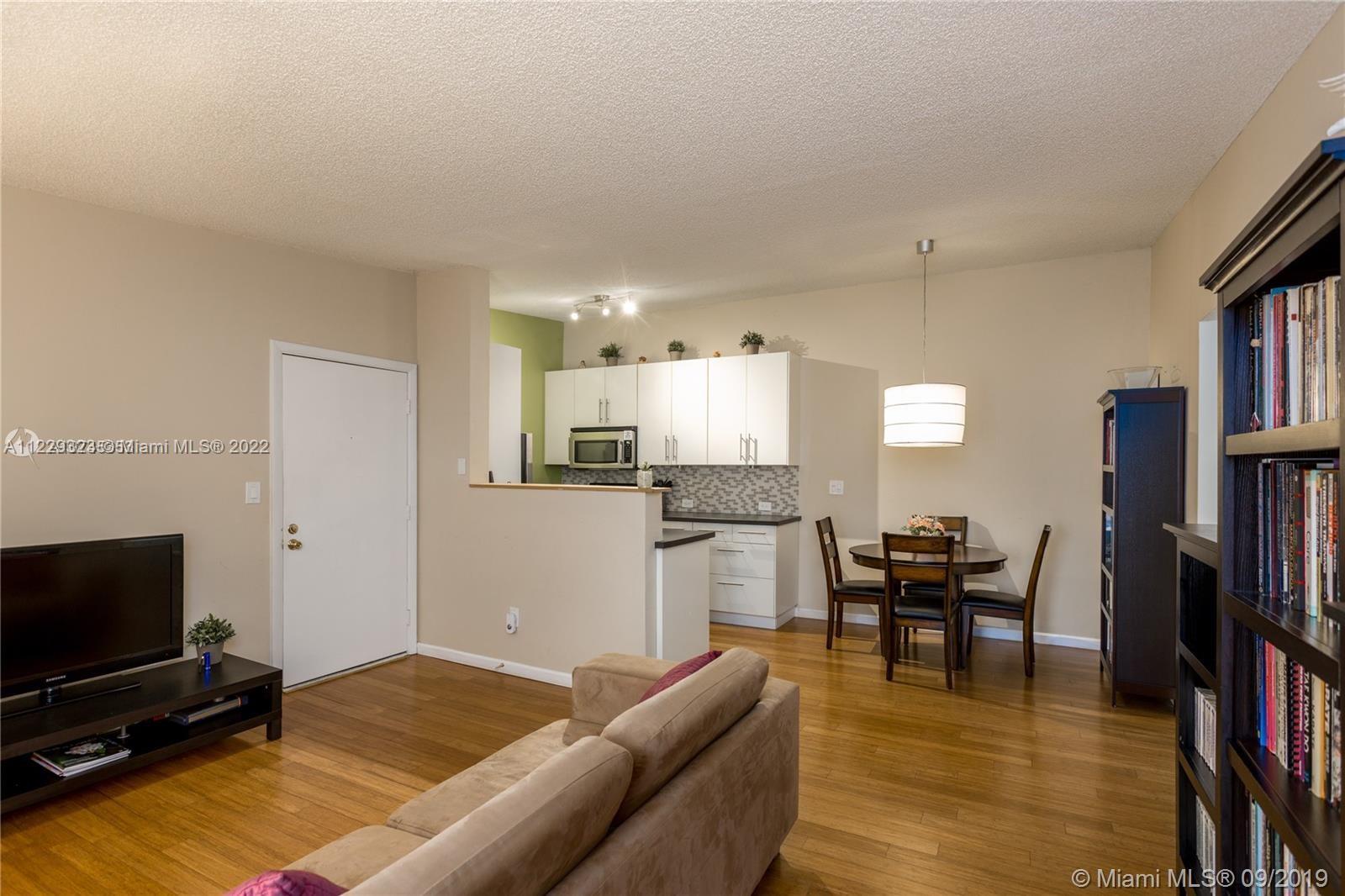 Nicely updated 2/2 in the beautiful community of Lakeview located in middle of the Hammocks. Unit features an upgraded kitchen with beautiful modern tile backsplash and SS appliances. Amazing hardwood floors throughout, and a large enclosed patio under ac adding extra living area that can be used as office or den. Washer & dryer in the unit. **UNIT IS ON 2ND FLOOR - NO ELEVATOR. NO MORE SHOWINGS.