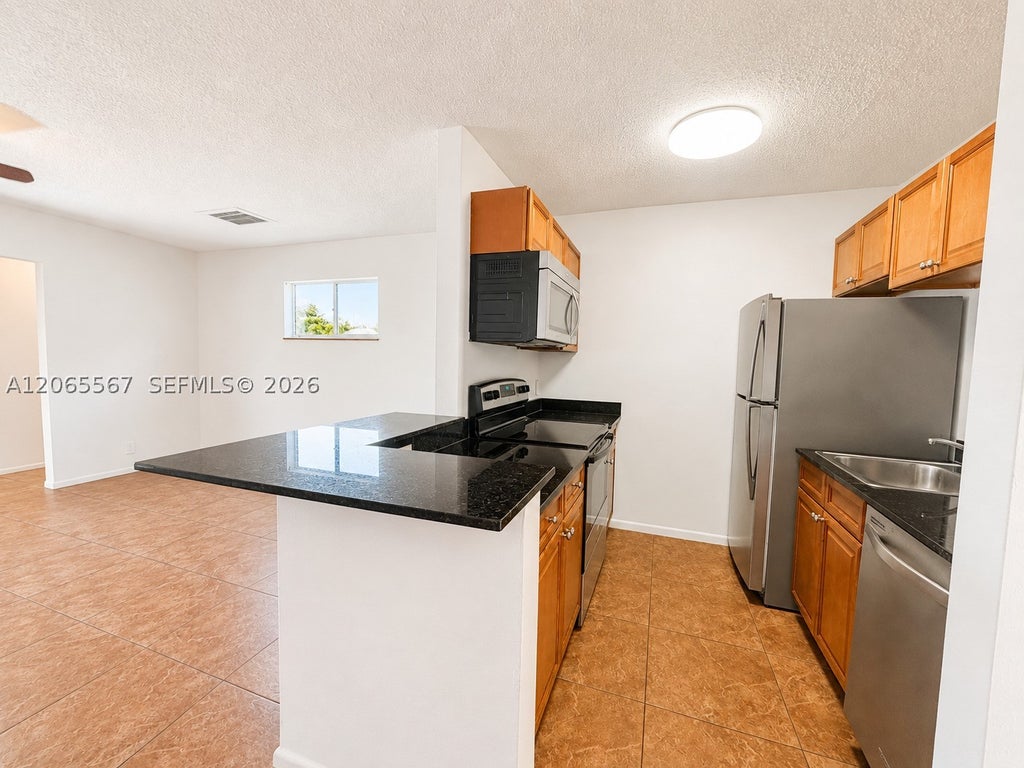 Photo of 28 Crossings Cir #E, Boynton Beach, FL 33435 (MLS # A12065567)