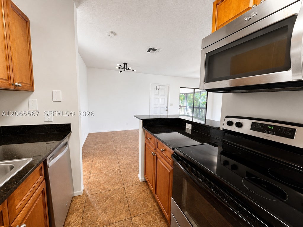 Photo of 28 Crossings Cir #E, Boynton Beach, FL 33435 (MLS # A12065567)