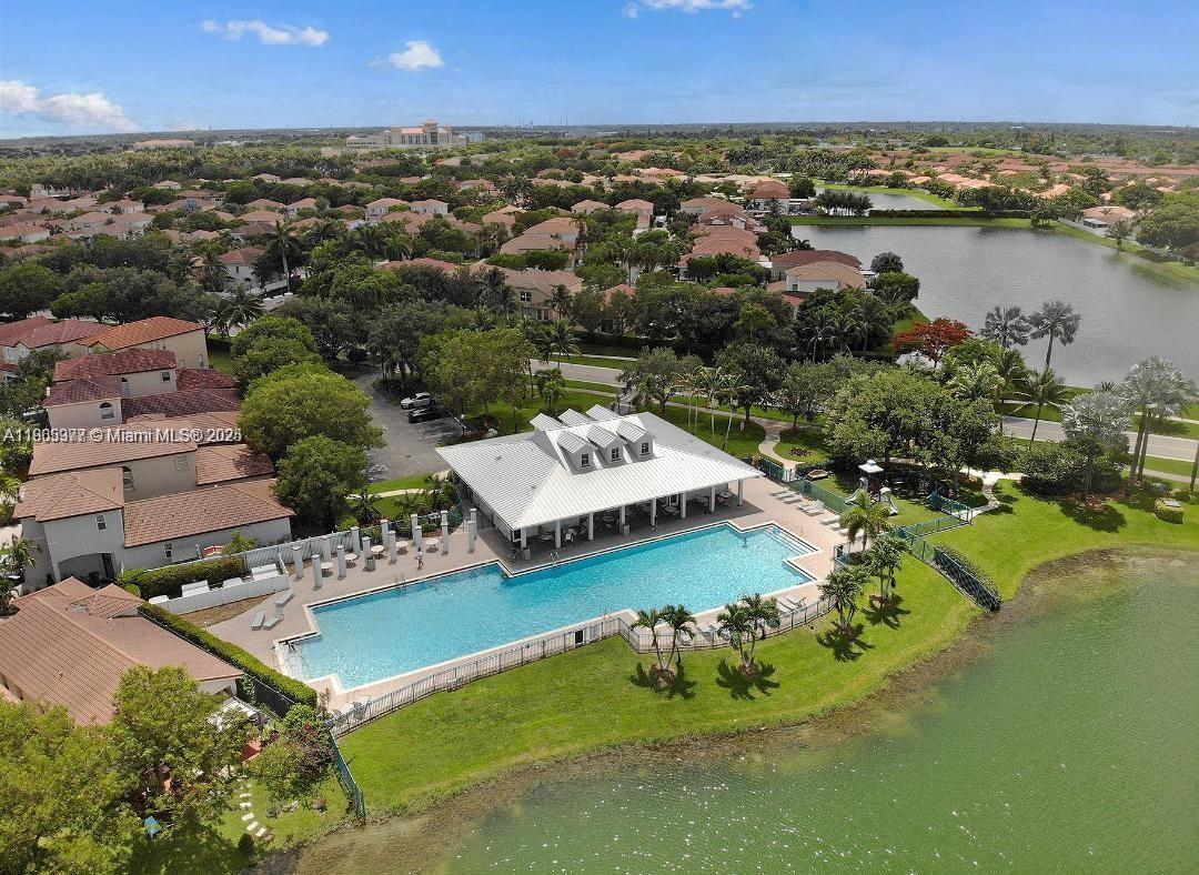 This perfectly laid out floor plan features 3-bedroom, 3 baths with an ensuite downstairs (1 bedroom, 1 bathroom) that makes it great for guests or homeowner to enjoy privacy and comfort. Washer and Dryer located inside the unit. plus, a newer Central A/C unit. The Waterstone Community offers a beautiful clubhouse, Olympic sized pool and fully equipped gym. Also has security guard at the gate for safety. May be financed easily due to fee simple designation.