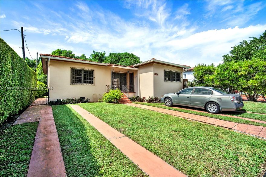 Welcome to this well-maintained home full of character and potential nestled on a quiet dead-end street. This property features spacious living area with plenty of natural light, tiled floors, and cozy decorative fireplace. The large bay window overlooks a neatly landscaped front yard with lush greenery and mature hedges for privacy.  Enjoy a long driveway, gated side entry, and classic wrought-iron details throughout.  Conveniently located near shops, schools and major highways, perfect for those seeking comfort, charm, convenience or a blank canvas to create their own space.