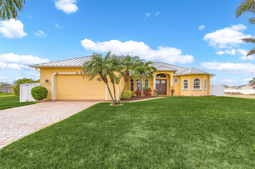 3 Bedrooms + Den + 3 FULL Bathrooms! Transferable flood insurance is only $1,083, and this home has NEVER flooded! Saltwater pool, heated, and ready for year-round enjoyment. Move right into this turnkey home in a desirable Cape Coral neighborhood near dining, golf, and fishing. Lush landscaping and a paver driveway lead to an oversized two-car garage with new cabinets. Inside, high ceilings, an open floor plan, and a spacious kitchen with granite countertops and new appliances await. The owner’s suite features pool access, dual walk-in closets, and a luxurious bath. Major updates include a new roof (2022), LVP flooring, A/C (2020), pool upgrades, a 500-gal reverse osmosis system, plantation shutters, and more!