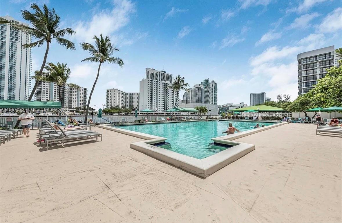 Floor to ceiling windows in this spacious 1 bedroom and 1 1/2 bath unit with den situated on the Intracoastal. . Pergo and tiled throughout. Stainless steel appliances. Walk-in closet. 40 year certification complete. Association with reserves. Wii-fi and hot water included in maintenance. Building has 24/7 attended lobby security, social activities, heated swimming pool, state-of-the-art gym, sauna, tennis, BBQ area, billiard, table tennis, bicycle storage and full-time management. Less than 2 miles to the beach, close to Hollywood Boardwalk, Aventura Mall, shopping, casinos, restaurants, race tracks, Brightline, marinas, golf course and Ft. Lauderdale Airport.