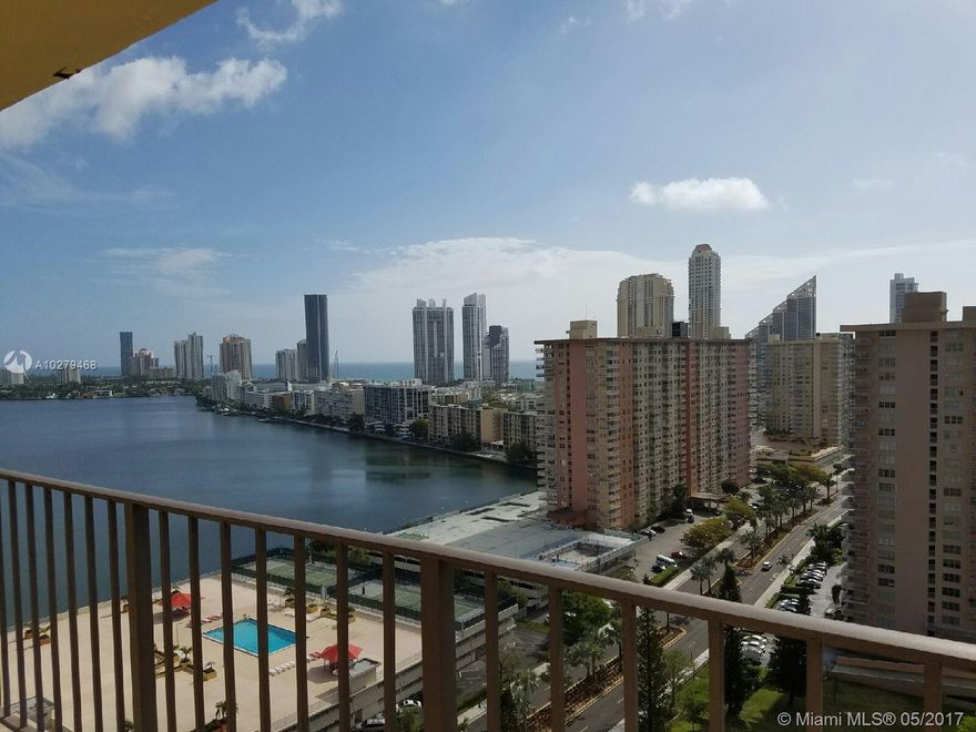 Completely renovated beautiful 1 bedroom with den, 1 and 1/2 bathrooms, porcelain tile floors throughout, stainless-steel appliances, walk-in closet, over-sized balcony. Washer and Dryer in unit. Breakfast nook in kitchen area.  Unit located in desirable Sunny Isles Beach area with 180 degree ocean views.  Unit comes with 2 covered parking spaces and extra storage bin. This full amenities building offers 24 hours security, valet, visitor parking, heated pool, shuffle board, gym, tennis.  Low maintenance includes basic cable, internet, appliance contract with Total, pest control. Walk to beach, near A rated schools, houses of worship, restaurants, and shops.