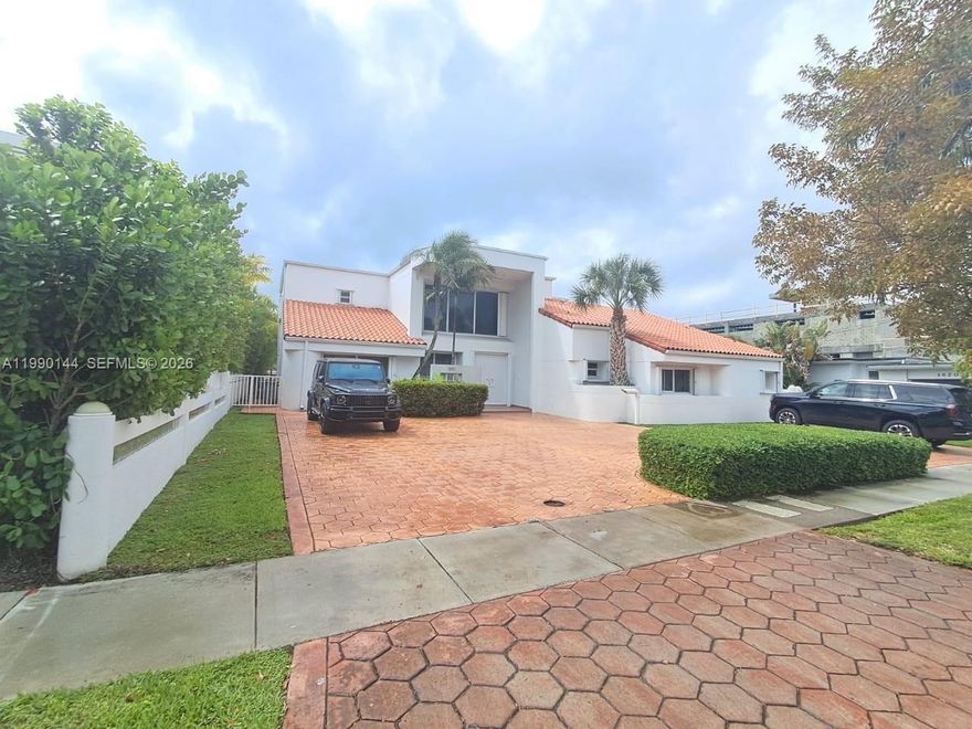 Enjoy exclusive island living on beautiful Biscayne Point.