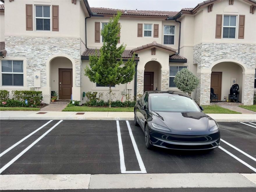 Beautiful 3 BD/3 BA townhouse in Westview ft. porcelain tile downstairs and waterproof laminate upstairs. The open-concept layout flows into a private backyard with an upgraded paver patio, ideal for relaxing or entertaining. The kitchen offers sleek stainless steel appliances and blends seamlessly with the living and dining areas. The spacious owner’s suite includes double sinks and a modern walk-in shower. Stylish porcelain tile finishes all bathrooms. Enjoy the convenience of an upstairs laundry area with washer and dryer included. Two assigned parking spaces are located directly in front of the home. With a low HOA and close proximity to shopping, schools, and major roadways, this home offers a perfect blend of comfort, style, and convenience. Furniture and accessories not included.