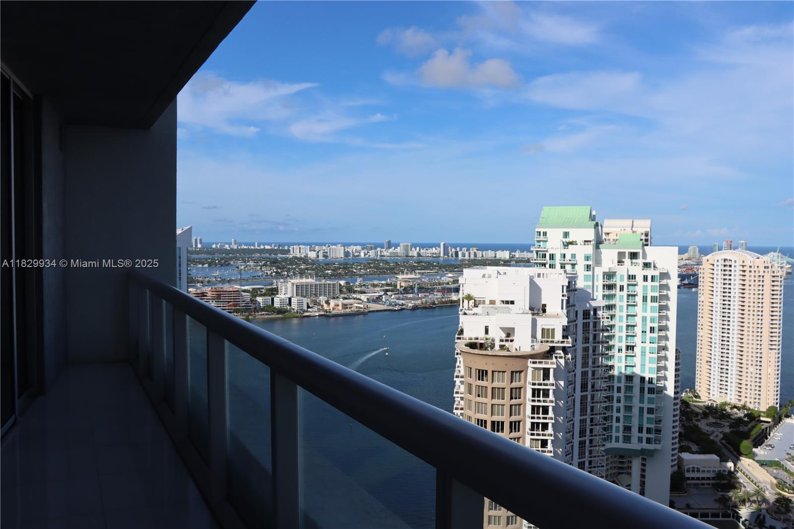 Exquisite 2BR/2BA + den in Icon Brickell Tower 1 with 1,665 total sq ft of elevated living. This beautifully upgraded residence features a freshly painted interior, new modern floorboards, new interior doors, a fully remodeled kitchen, and polished floors throughout. Enjoy floor-to-ceiling glass with panoramic bay, ocean, and city skyline views from an expansive balcony. Added UV light in the AC system enhances air quality. Icon Brickell offers 5-star amenities: Olympic-size pool, world-class spa, fitness center, valet, 24/7 concierge, and on-site restaurants. Walk to Brickell City Centre, dining, and more.