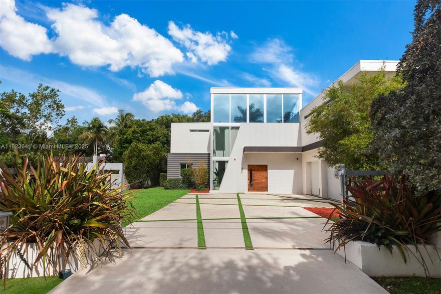 Located in the heart of Pinecrest, this gated modern estate offers luxury, privacy, and a family-friendly layout. With 6 bedrooms, 5 baths, a media room, office, and 3-car garage with EV charging, this 8,200 SF  home is designed to impress. The kitchen features Italian cabinetry, quartz countertops, and top-tier appliances. A floating wood staircase leads to a loft and a lavish primary suite. Enjoy resort-style outdoor living with a summer kitchen, pool, and spacious terrace. Minutes from top rated schools.