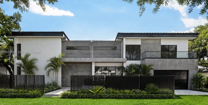 Set in one of Miami’s most sought-after neighborhoods, this newly built 6-bedroom, 7.5-bath modern home offers 6,936 SF on a 12,150 SF lot—designed for elevated living and entertaining. A custom wood entry opens to soaring 11-foot ceilings, an open layout, and expansive glass doors for seamless indoor-outdoor flow. Spanish grey tile floors span the main level, with engineered Spanish wood upstairs. Formal living and dining spaces feature striking modern concrete accents, while a spacious family room and dedicated breakfast area enhance functionality and comfort.All bedrooms are en-suite with walk-in closets. The primary suite offers a private balcony, custom his-and-hers closets, and a spa-like bath with steam shower and dual vanities. The chef’s kitchen features Scavolini cabinetry, quartz countertops, dual islands, Gaggenau appliances, and a walk-in butler’s pantry. Additional highlights include housekeeper’s quarters, laundry room, smart home wiring, and integrated sound. Outdoors, enjoy a resort-style experience with a heated 20x35 saltwater pool and spa, expansive covered terrace with wood ceiling detail, and a bespoke summer kitchen by John Michael Studios. Tropical landscaping provides privacy, while premium impact windows and doors, a metal roof, five-zone A/C, generator-ready setup, and a secure gated entrance complete this exceptional residence.