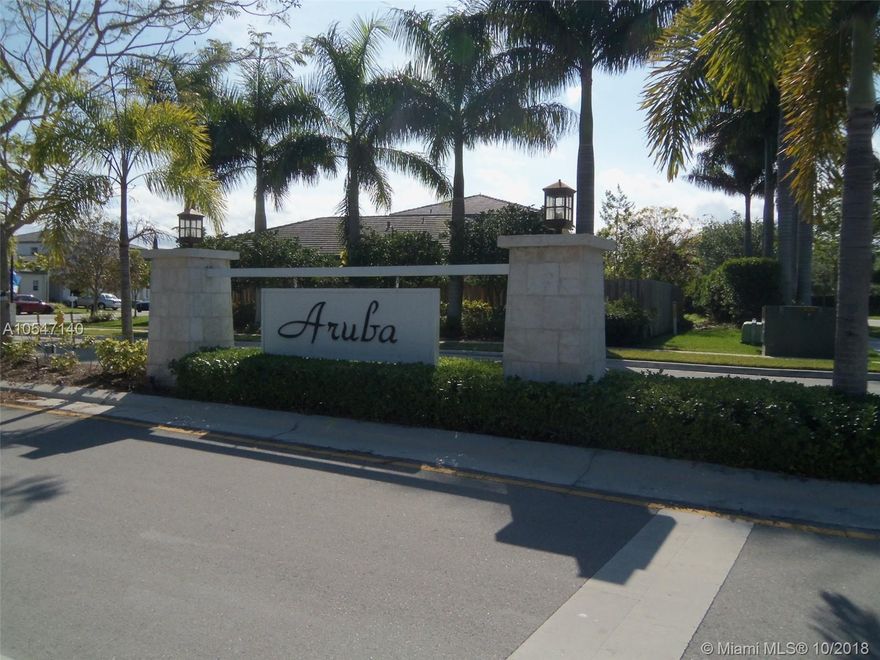 Will rent FAST. Come and enjoy this lovely 5/3, 2 story home, in the gated community of Aruba, one bedroom and one bath downstairs. Completely tiled throughout first floor, carpet second floor, gourmet kitchen boasts granite counter tops, new wood cabinetry, stainless appliances, open concept leads to formal dining & living area, master bedroom with ensuite bath, separate shower, two car garage, meticulous landscaping, community pool, sauna, gym, close to highway, schools, shopping. Live in style !