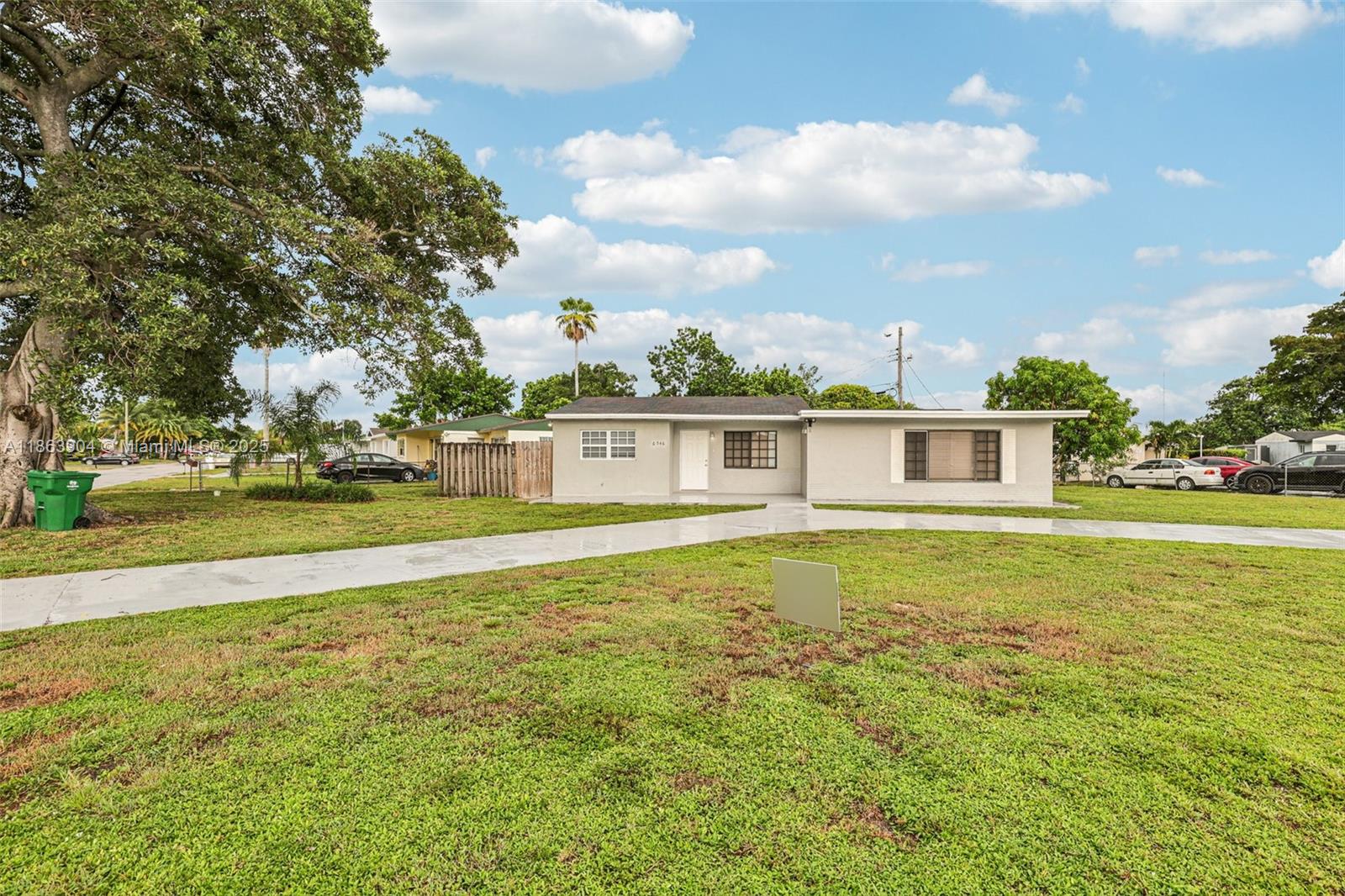 Welcome to this 4-bedroom, 2-bath, 1,540 sq ft home in Miramar, offering a covered front porch entry and a bright, inviting layout. Updated vinyl flooring flows through the living room and bedrooms, while large windows fill each space with natural light. The kitchen features modern appliances, including a stove with a self-cleaning oven. Every bedroom includes a ceiling fan for year-round comfort! Enjoy the expansive front yard, perfect for outdoor activities and entertaining. Ideally located near shopping centers, local parks, and dining, with easy access to major roads for commuting. Just a short drive to Hollywood Beach, Hard Rock Stadium, and area attractions, this home blends convenience, comfort, and style in a sought-after South Florida location.