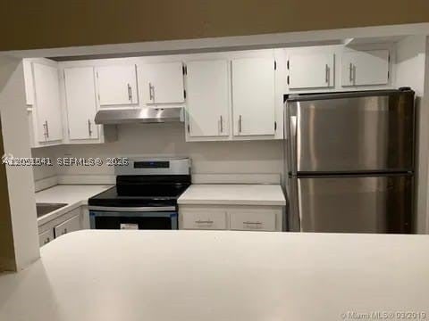 Photo of 4168 Inverrary Dr #305, Lauderhill, FL 33319 (MLS # A12051541)