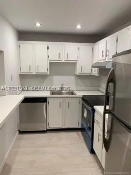 Photo of 4168 Inverrary Dr #305, Lauderhill, FL 33319 (MLS # A12051541)