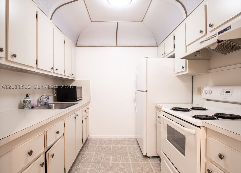 Photo of 13450 SW 3rd St #310D, Pembroke Pines, FL 33027 (MLS # A12111622)