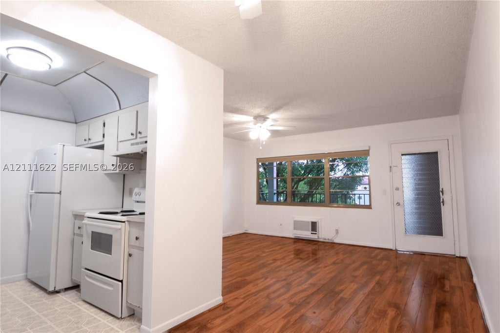 Photo of 13450 SW 3rd St #310D, Pembroke Pines, FL 33027 (MLS # A12111622)