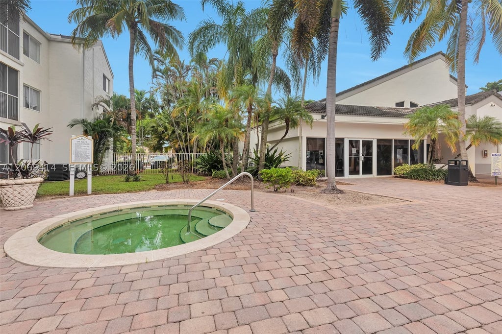 Photo of 5760 Rock Island Rd #339, Tamarac, FL 33319 (MLS # A12069414)