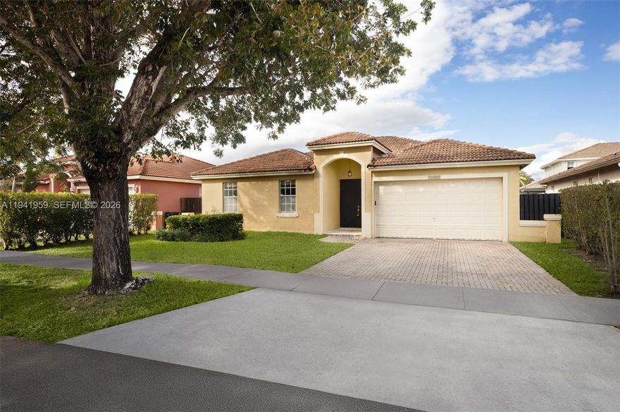 Beautifully updated 4-bedroom, 2.5-bath pool home in the sought-after Hammocks neighborhood. This spacious residence features a bright open layout with tiled living areas and carpeted bedrooms. The modern kitchen offers granite countertops, stainless steel appliances, and ample cabinetry, flowing seamlessly into the main living space. The generous primary suite includes a spa-style bath with separate tub and shower, bidet, and dual vanities. French doors open to a covered terrace and a 15x30 pool, creating the ideal setting for outdoor relaxation and entertaining. Additional highlights include a 2-car garage, walk-in closets, and lush landscaping. Rent includes yard maintenance, pool service, and pest control, providing a turnkey experience in one of West Kendall’s most established communities.