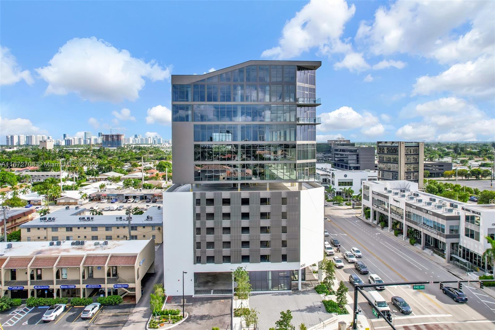 Atlantic Village Professional Center at 800 N Federal Highway offers 110,000 square feet of modern commercial space in the highly sought-after mixed-use development of Atlantic Village in the vibrant Hallandale Beach, Florida. Welcomed by a unique and modern façade, this 12-story Class A property offers a variety of retail, office, and medical condos. The building is ideally positioned within the development, providing easy and unparalleled access to various dining, shopping, and entertainment options. Gridline Properties is proud to present Phase IV of Atlantic Village. These exclusive ninth-floor office condos feature floor-to-ceiling windows with unobstructed views, covered parking, private terraces, and building signage opportunities.