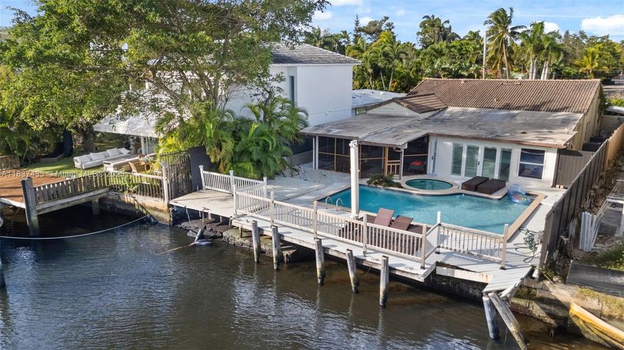 Deep canal w/direct access to the Bay and Ocean. On a 24 Hrs. gated security community. Remodeled spacious existing home with four Bedrooms & generous sizes, gourmet kitchen, high exposed wood ceilings, great water and garden views. Spacious back yard, with pool, jacuzzi and lush landscape. 50 ft of waterfront with full dock. Belle Meade is centrally located, in the heart of Miami. Minutes to Design District, Downtown Miami, & beaches. Best priced waterfront property in Belle Meade, Real Seller & great income potential!