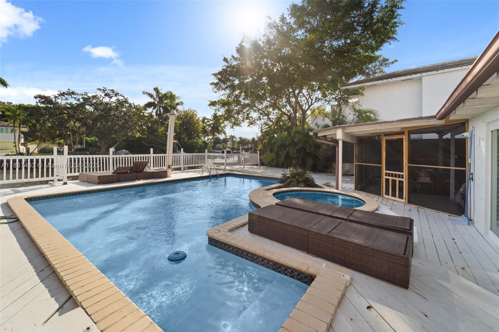 Charming waterfront Mediterranean residence. Deep canal w/direct access to the Bay and Ocean. On a 24 Hrs. gated security community. Remodeled 4 brms w/ generous sizes, gourmet kitchen, high exposed wood ceilings, great water and garden views. Spacious back yard, with pool, jacuzzi and lush landscape. 50 ft of waterfrontage and full dock. Belle Mead is centrally located, in the heart of Miami. Minutes to Design District, Downtown Miami, & beaches. Least expensive waterfront home in the subdivision. Wont last!