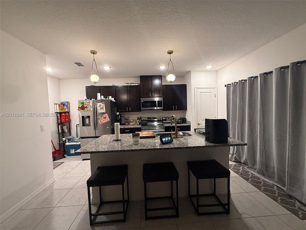 Photo of 1557 SW Dycus Ave, Port St Lucie, FL 34953 (MLS # A12012981)