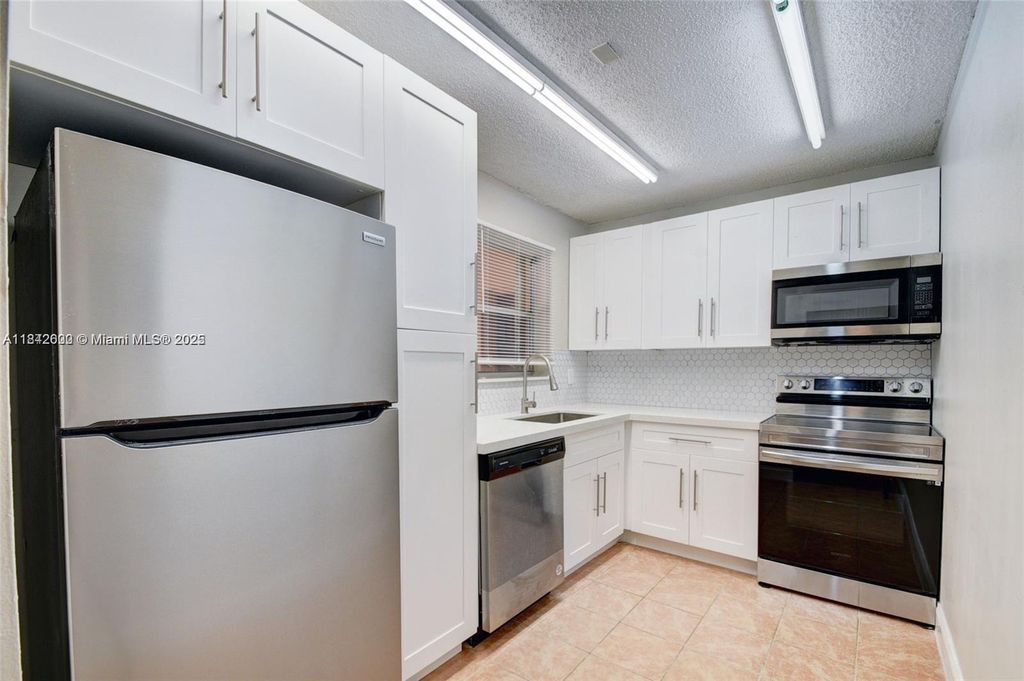 Photo of 114 Lake Anne Dr #114, West Palm Beach, FL 33411 (MLS # A11842600)