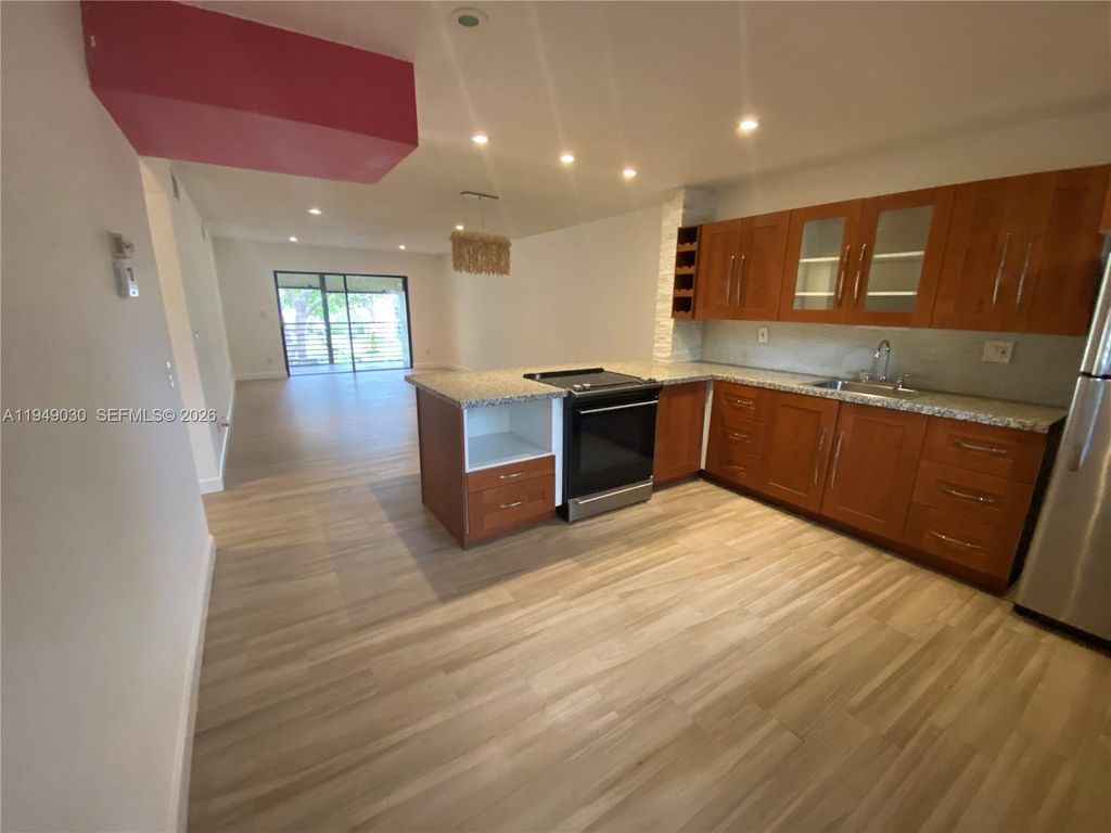 Photo of 6090 N Sabal Palm Blvd #208, Tamarac, FL 33319 (MLS # A11949030)