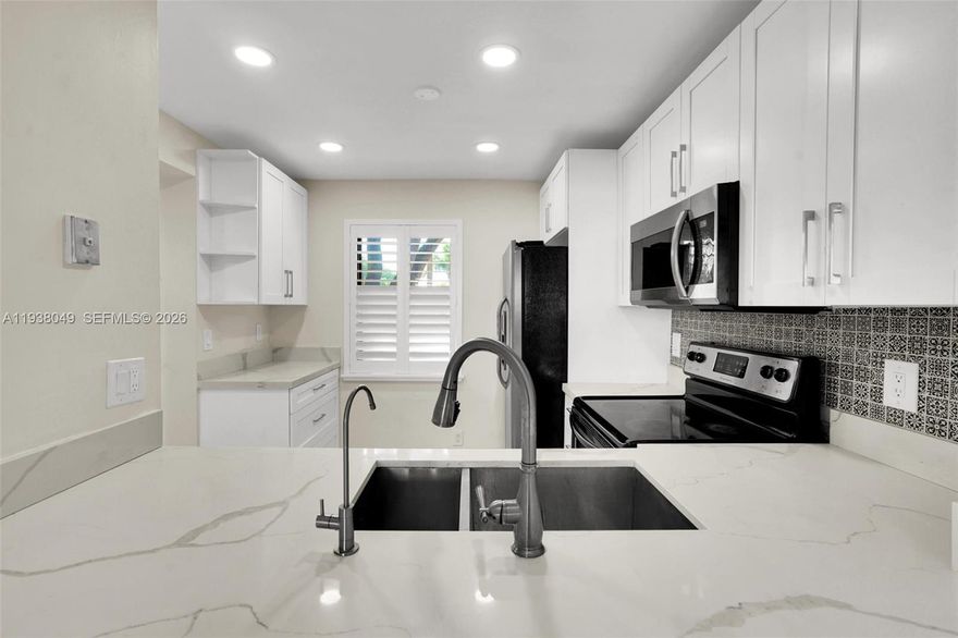 SELLER OFFERING $7,500 TOWARDS INTEREST RATE BUY DOWN, closing costs or prepaids! Beautiful and well maintained 2 bed, 2 bath, amazing amenities; CORNER UNIT! New tile throughout the entire unit. Unit boasts a remodeled master bath, remodeled kitchen, and newer vanities in both bathrooms! Plantation shutters on all windows, Impact Windows in the front. Unit includes a new (2021) Washer, Dryer, Dishwasher and Microwave. Under Kitchen Sink, Reverse Osmosis Filtration System. Clean Water! VERY DESIRABLE COMMUNITY & LOCATION. Tennis court views, storage on 3rd floor, storage in balcony. New AC in 2021. Well-kept pool & spa area, tennis courts, kids playground, clubhouse for gatherings. Lush tropical landscaping. Night Security on premises. Pet friendly. Quiet community. Close to heart of Plantation. Shopping and restaurants down the street. I-95 & 595 sawgrass PKWY close by. Minutes from downtown Ft Lauderdale. Come see your New Home!