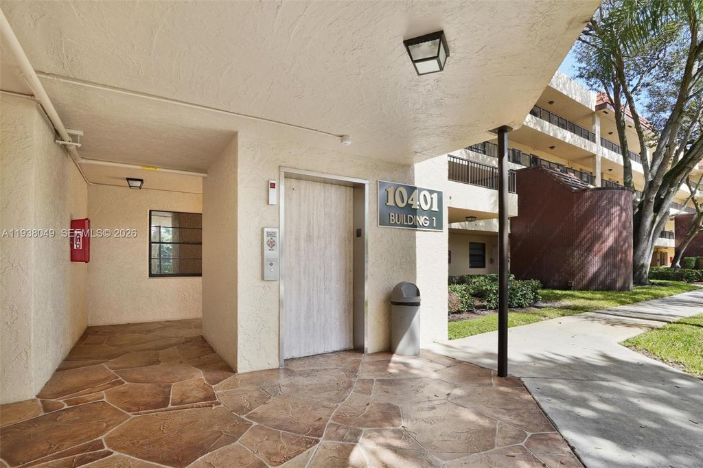 Photo of 10401 W Broward Blvd #205, Plantation, FL 33324 (MLS # A11938049)